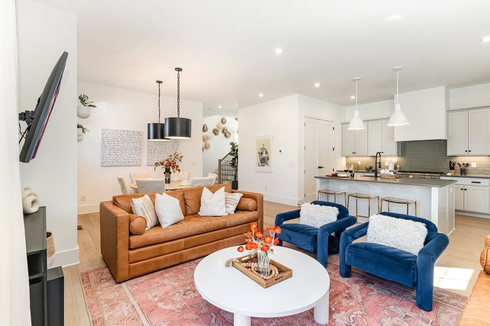 2nd Floor: Warm and inviting open-concept living area with a smart TV and plush furnishings
