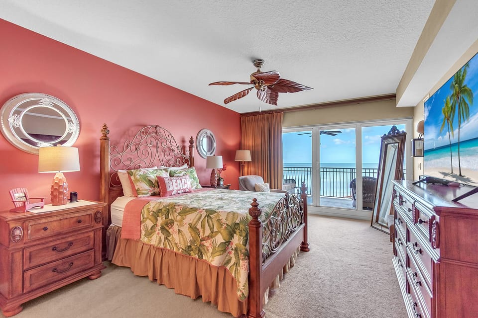 Master Bedroom with Queen Bed, TV and Balcony Access