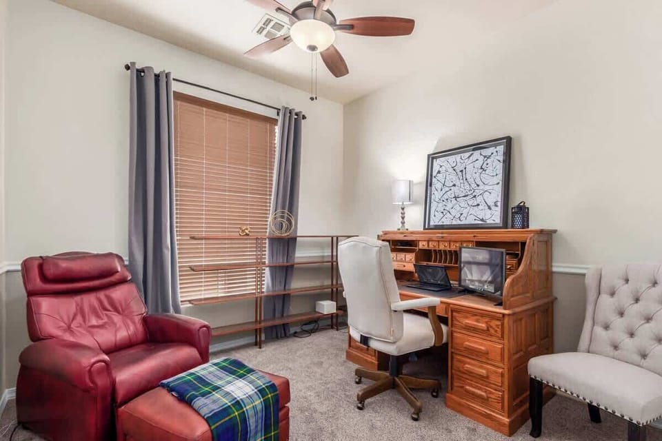 Dedicated office room with desk and monitor, perfect for remote work.