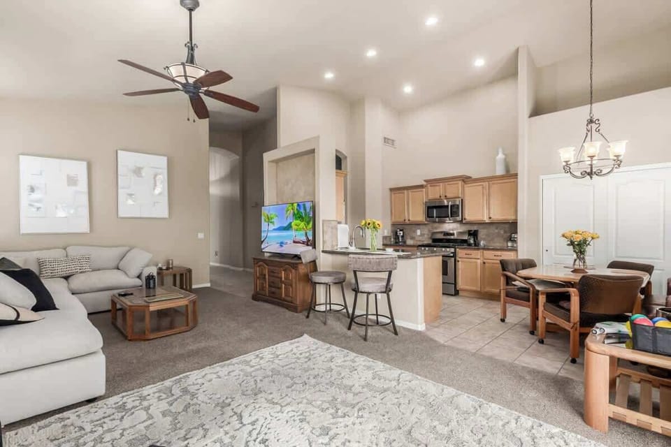 Cozy living space with smart TV and comfortable seating.