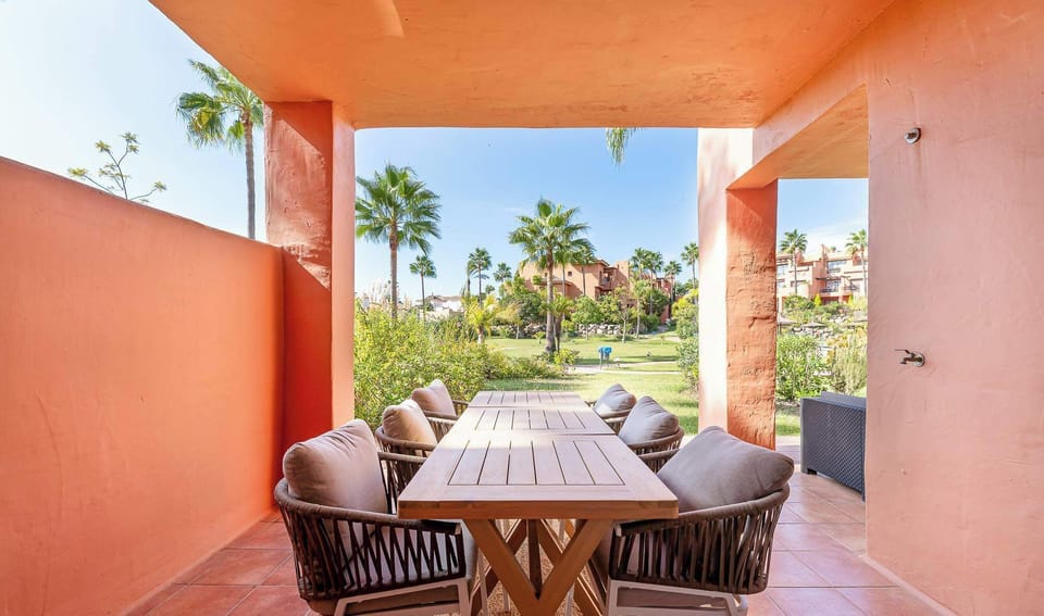 Al Fresco Dining Terrace: Enjoy peaceful meals and drinks on the covered patio. This serene, tile-floored space overlooks the sunny outdoor area, perfect for group gatherings or quiet morning coffee.