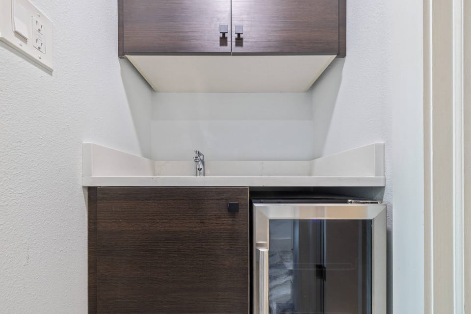 Mini-Fridge and sink, two queen beds, bathroom, workstation