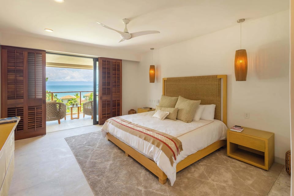 Ocean-view master bedroom with king-size bed
