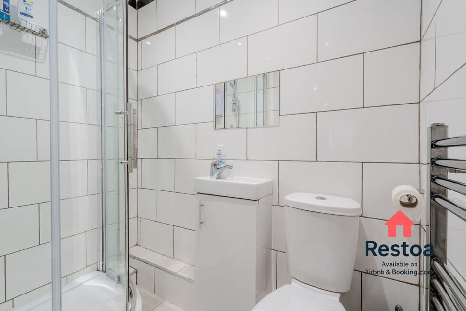 Spotless modern bathroom with walk-in shower