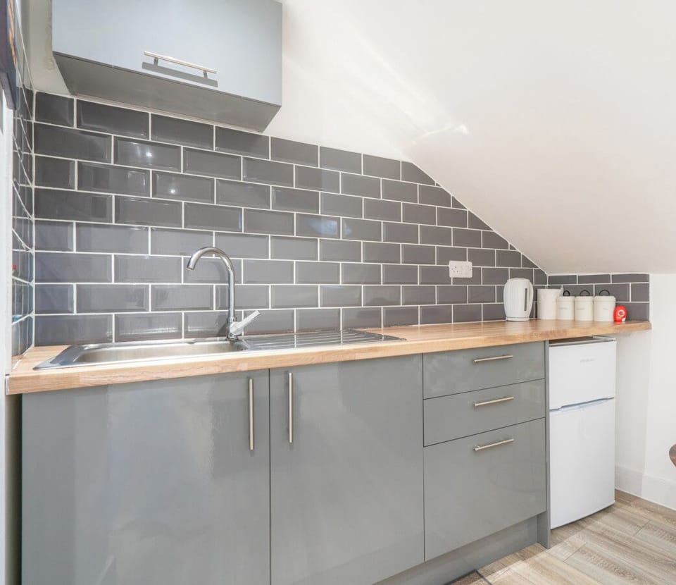 Functional kitchen area with sink and storage