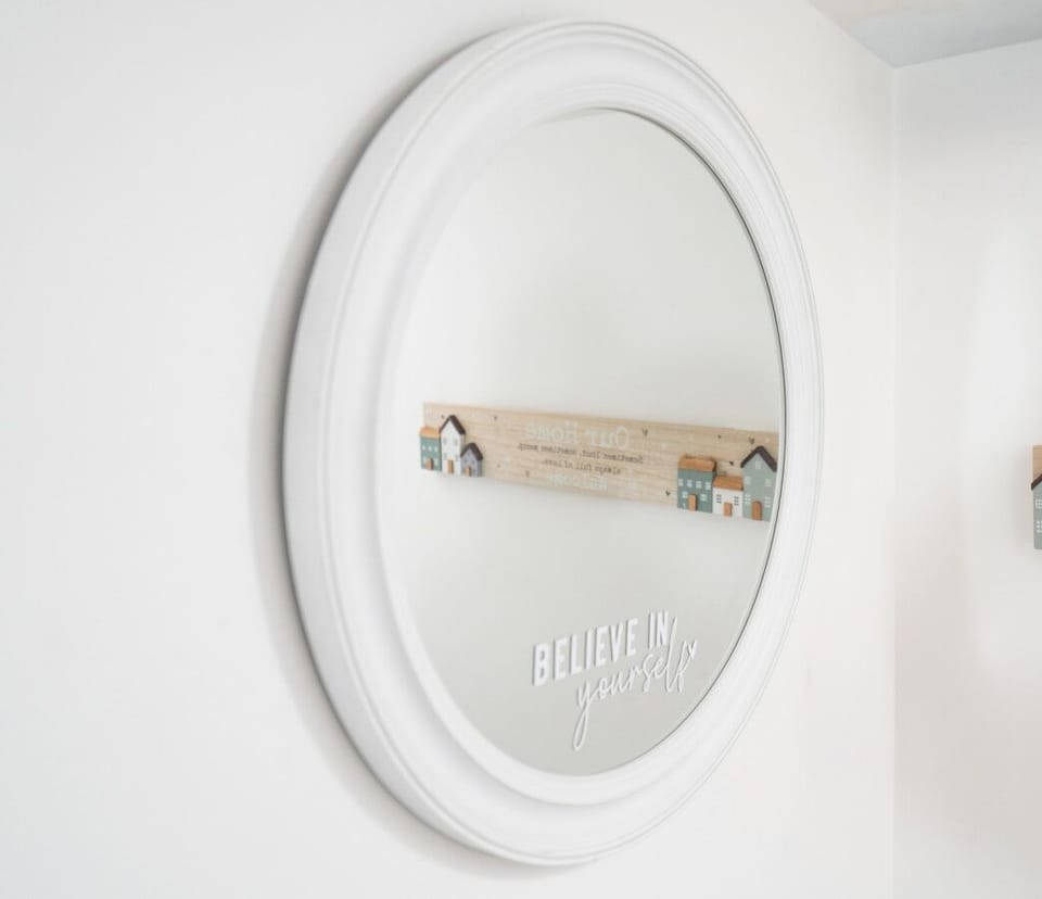 Decorative mirror with positive message.