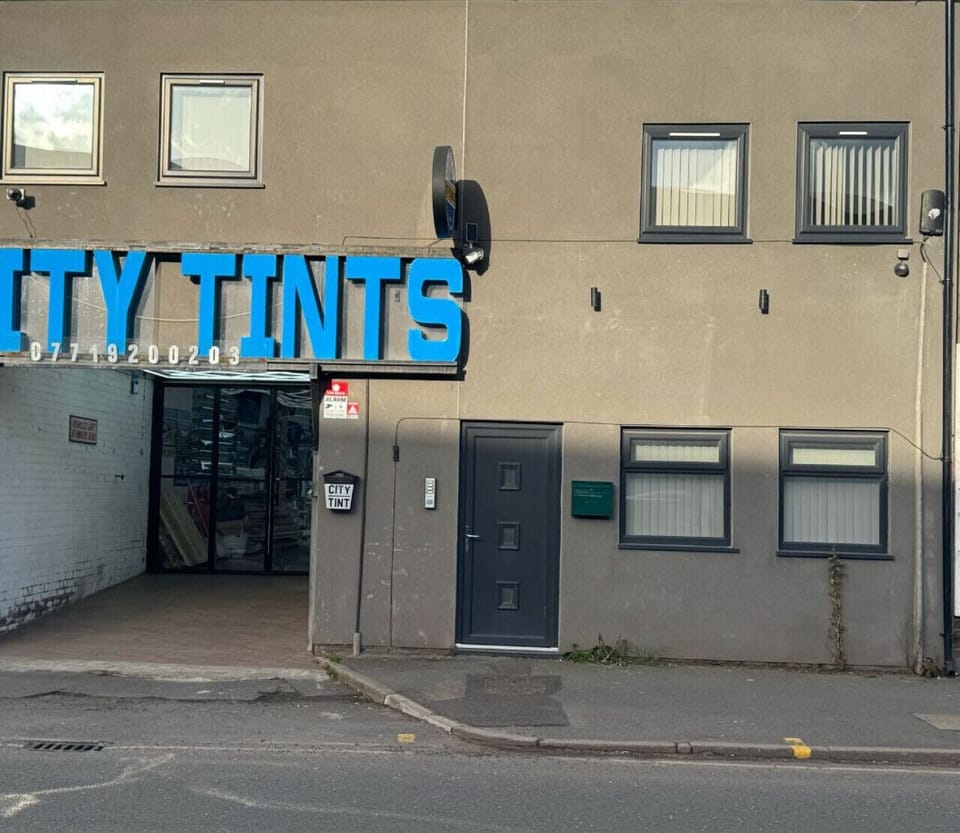 Entrance to the property, to the right of City Tints