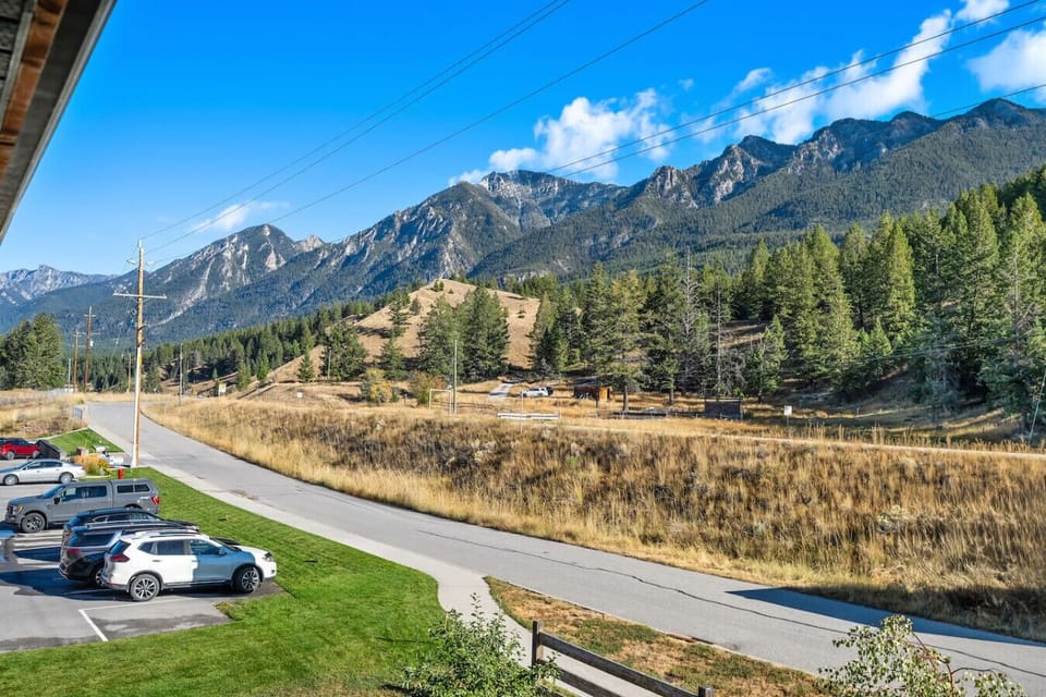 Private balcony with a BBQ, outdoor seating and Rocky Mountain Views