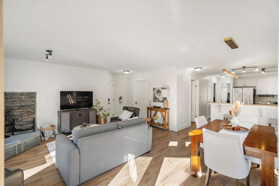 Living room with a wood-burning fireplace, smart TV, board games & cozy seating