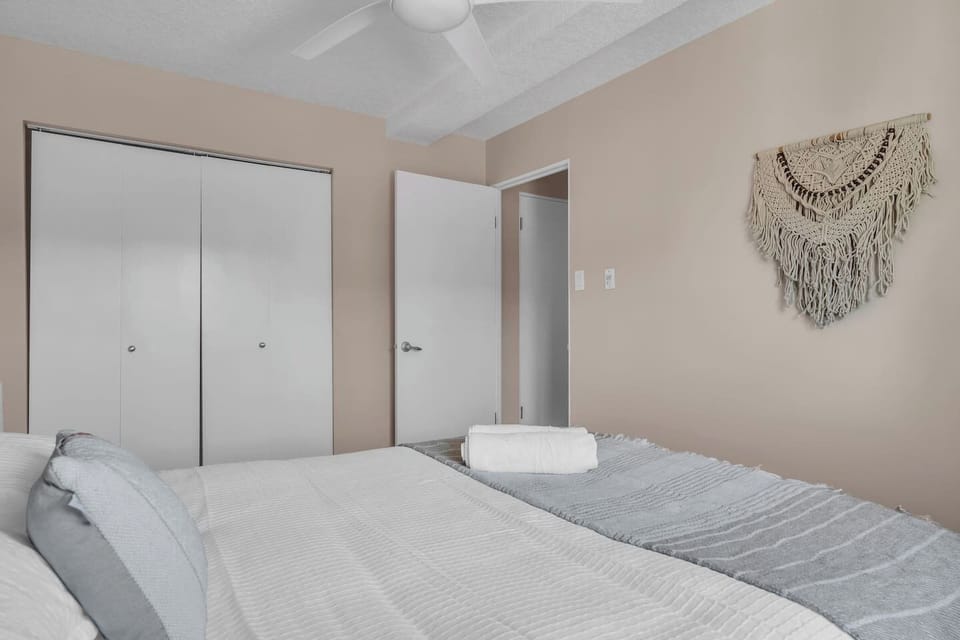 Cozy Bedroom with a Queen-Size Bed and a Quiet Fan for a Comfortable Night's Sleep