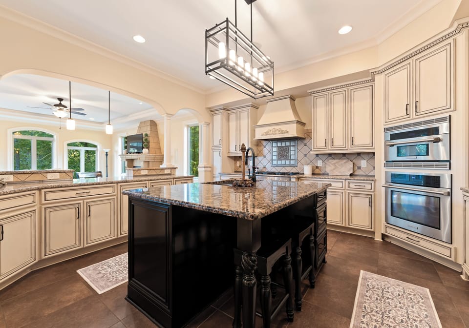 Fully stocked kitchen with island and bar seating.