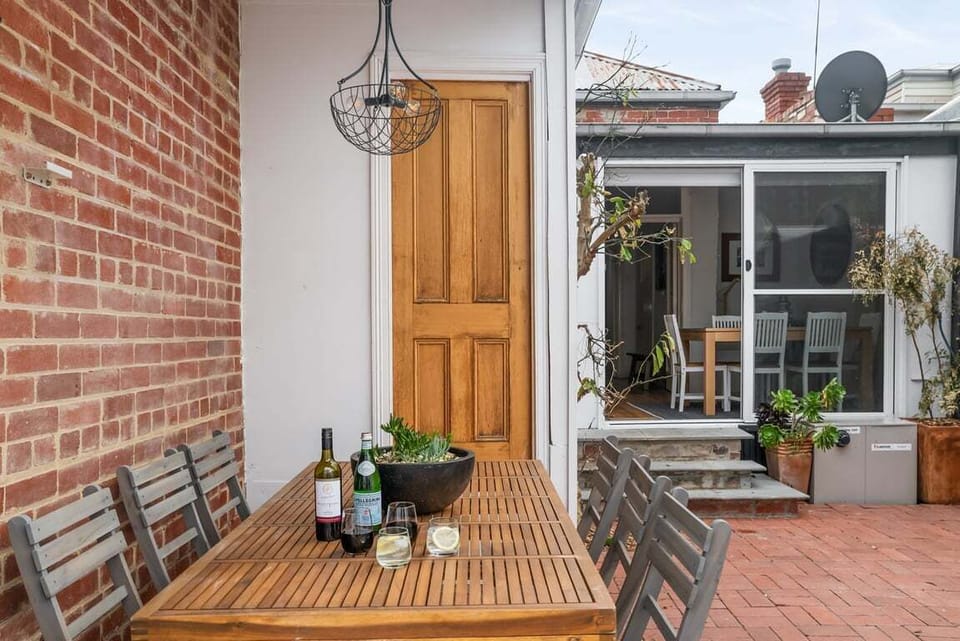 AL FRESCO DINING: The outdoor table setting that comfortably seats six is perfect for al fresco dining and entertaining.