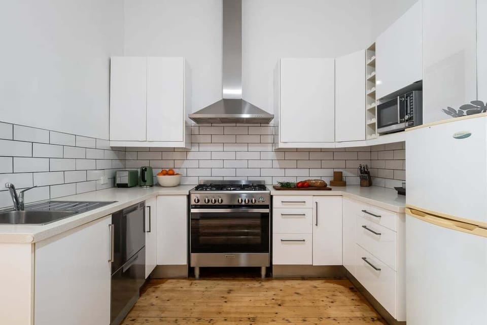 KITCHEN: The fully equipped kitchen has all the needed appliances with a 900mm chef's gas cooktop and oven and a pantry stocked with cooking basics for the cooking convenience.