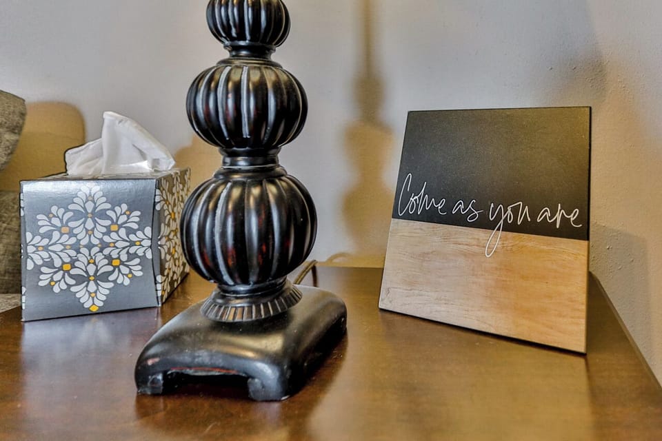 Warm, neutral tabletop decor with earthy tones and a cozy, modern-rustic style.