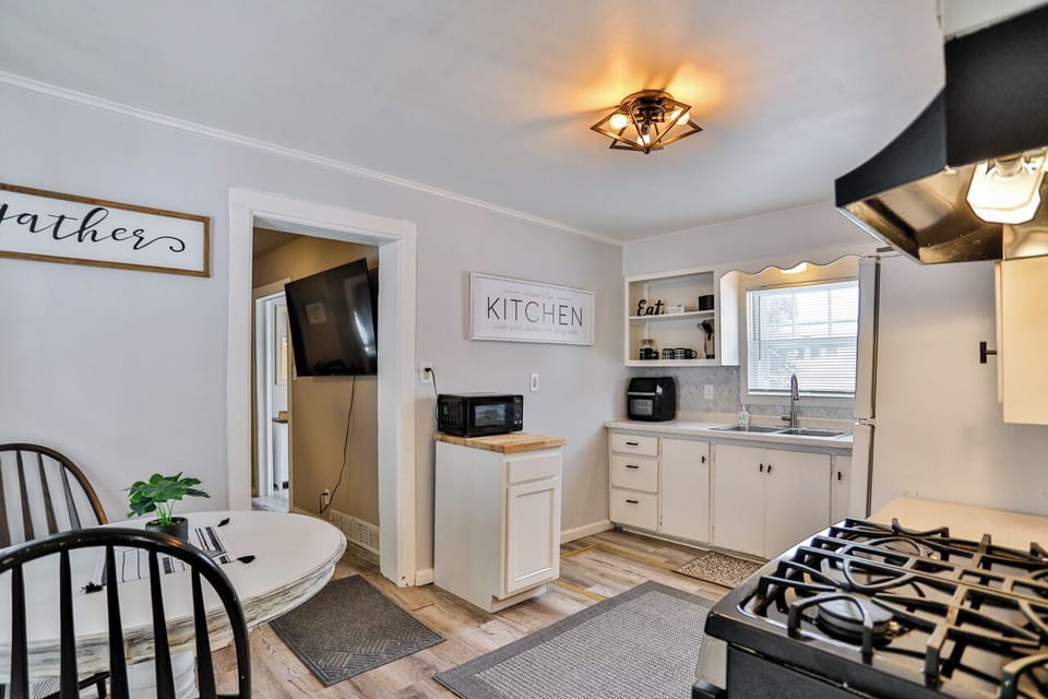Open kitchen with full-size appliances and a small dining space for everyday meals.