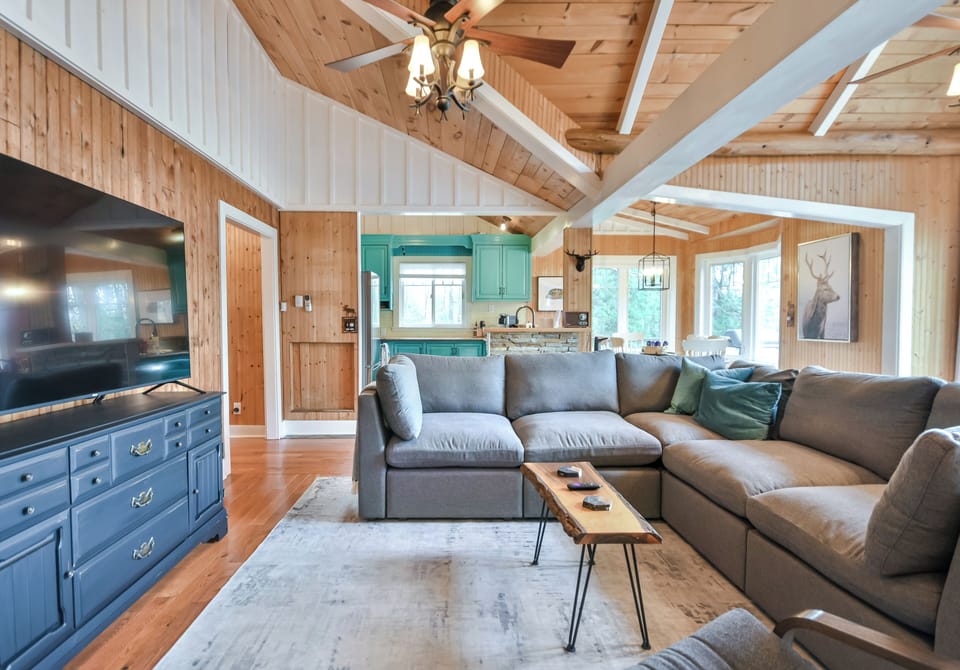 A large Cozey sofa to enjoy a movie in the open concept living room
