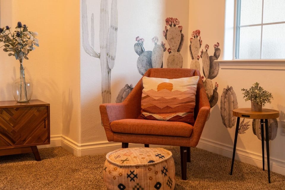 Curl up with a book in this cozy reading nook featuring warm desert-inspired décor.