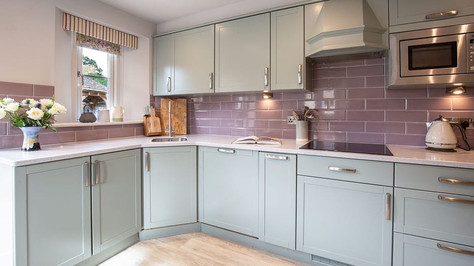 There is an oven and hob, microwave, coffee machine, fridge/freezer, kettle and toaster. Hidden