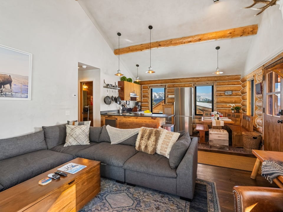 Living room: Gas fireplace, Smart TV, sectional sofa, slope views