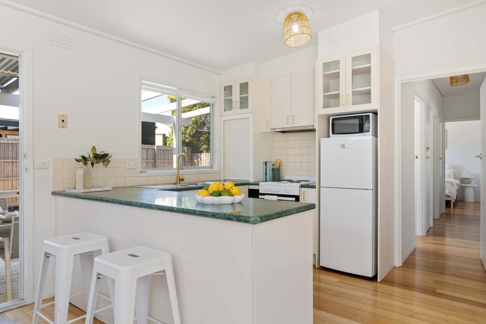 Open-plan kitchen with breakfast bar