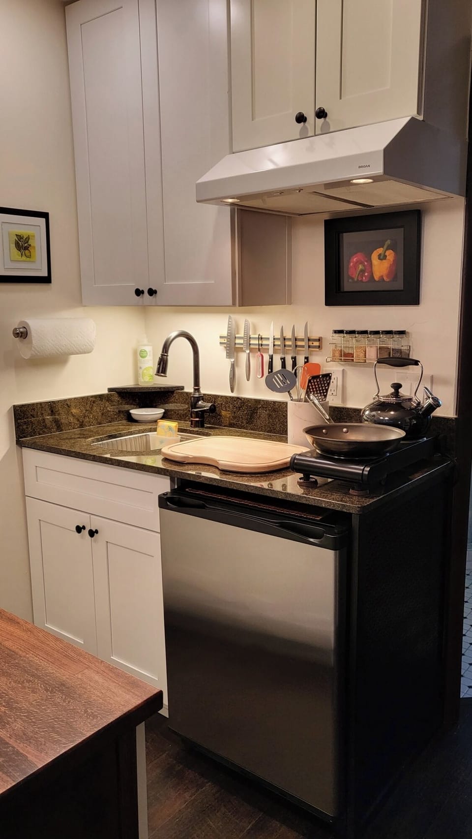 Fully stocked kitchenette with modern essentials, perfect for cozy home-cooked meals.