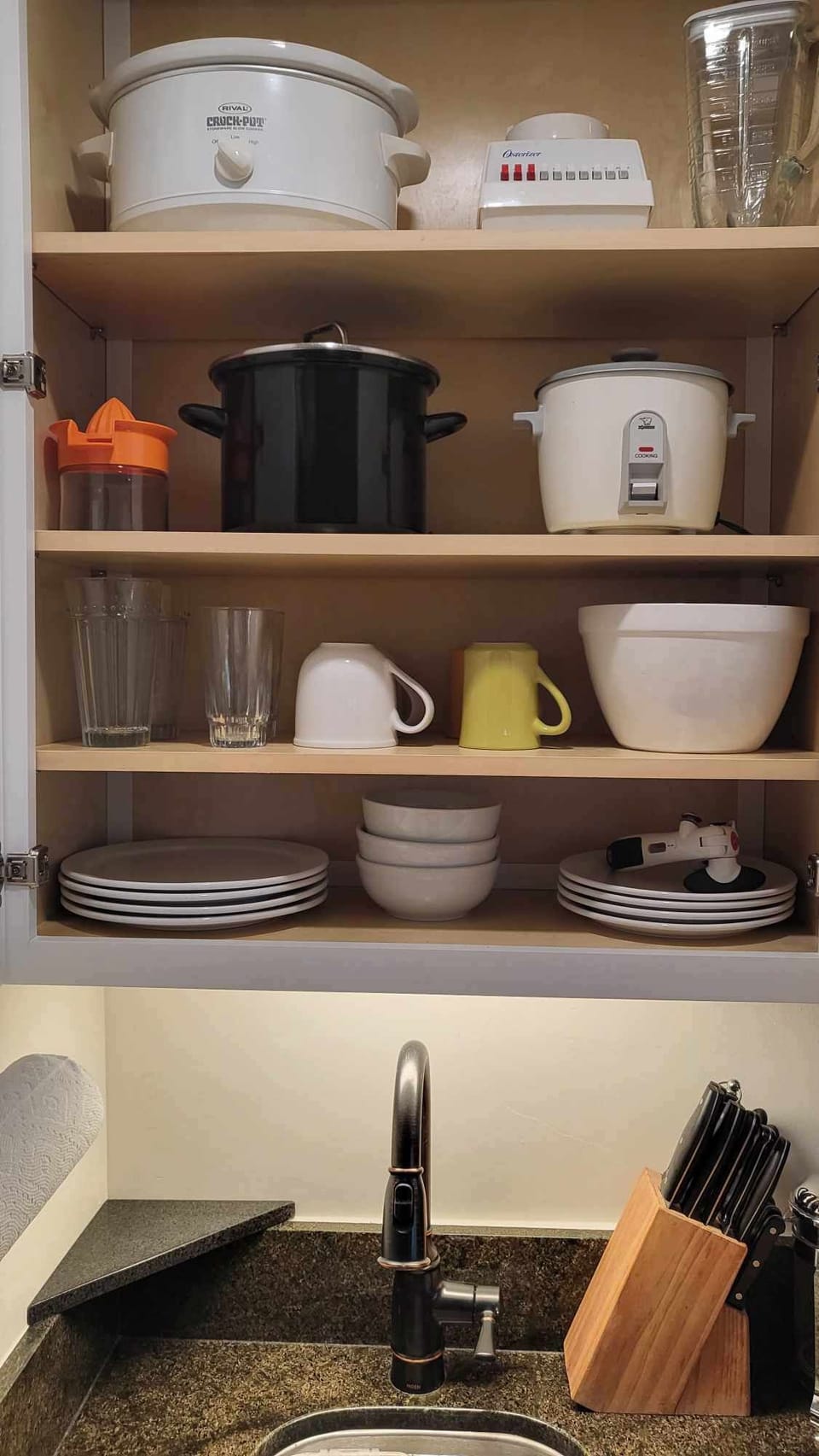 Fully stocked kitchenette with cookware, dinnerware, and all the essentials for a comfortable stay.