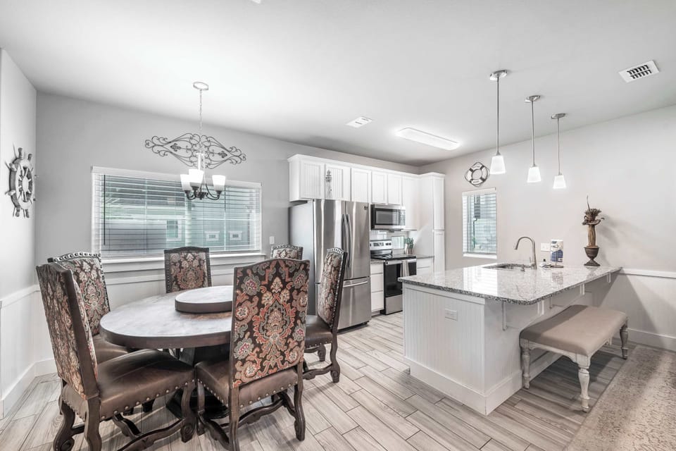 Big table, bigger laughs. Whether it’s family feasts or takeout nights, this dining space was built for togetherness.