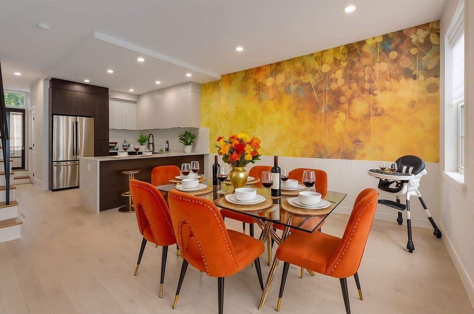 ELEGANT DINING ROOM! Sophisticated space with orange velvet chairs, wine service, and high chair for families. Perfect for special meals and celebrations. Book your upscale family stay today! #ElegantDining #FamilyFriendly