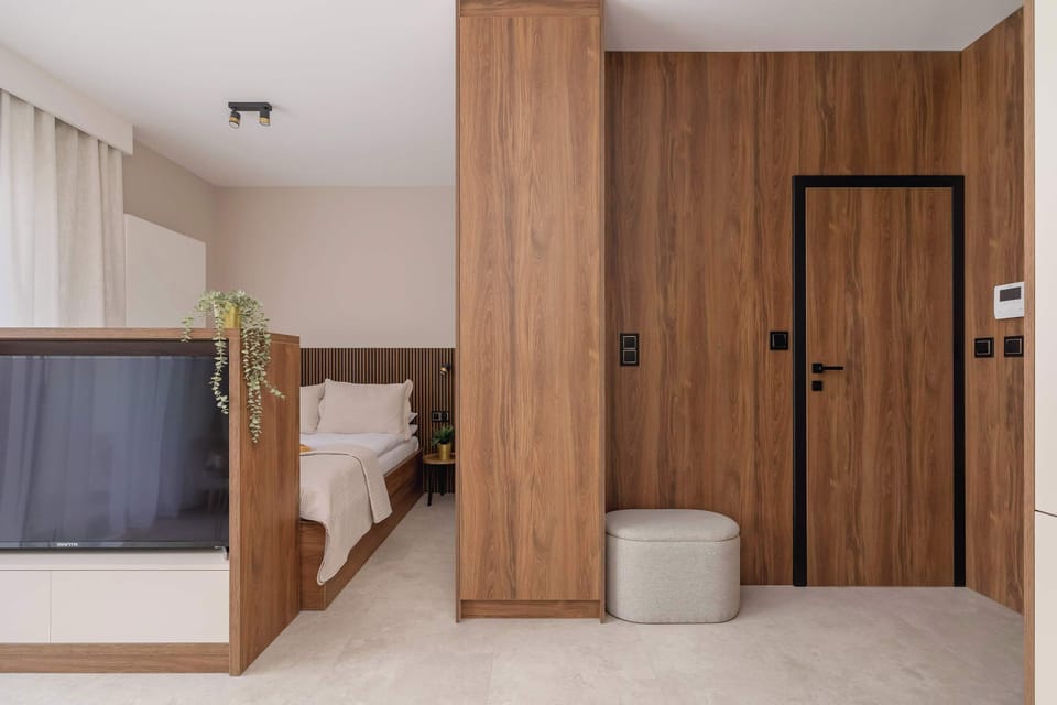 A well-organized bedroom zone with wooden elements and built-in storage. Designed to maximize space.