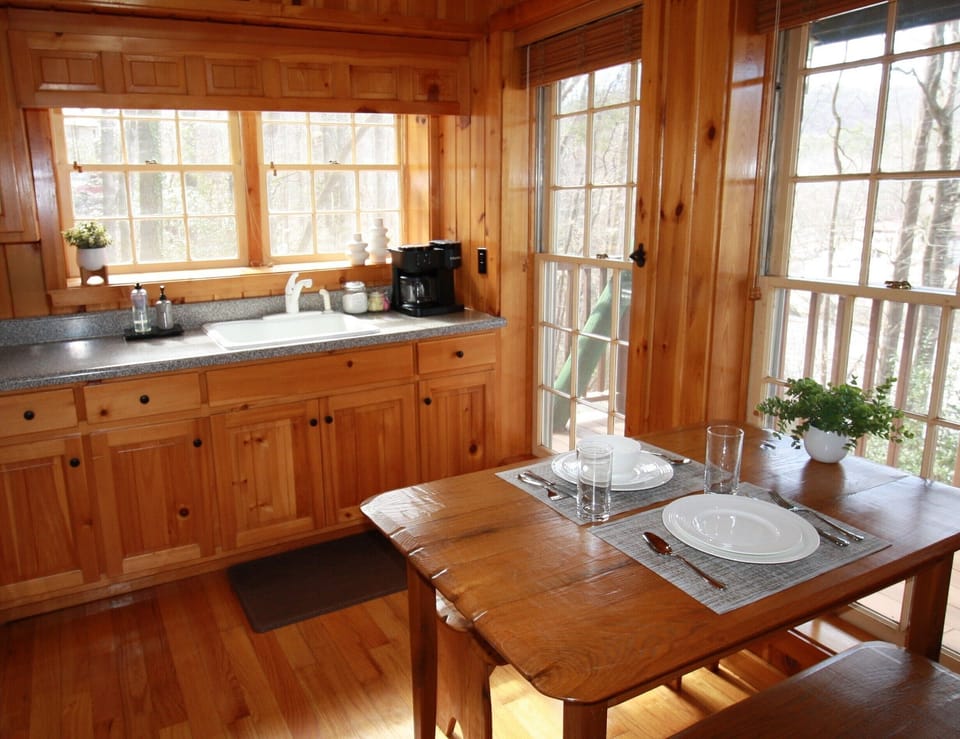 Updated kitchen with cabinets full of dishes, pots, pans, utensils and more to assist with meals large and small