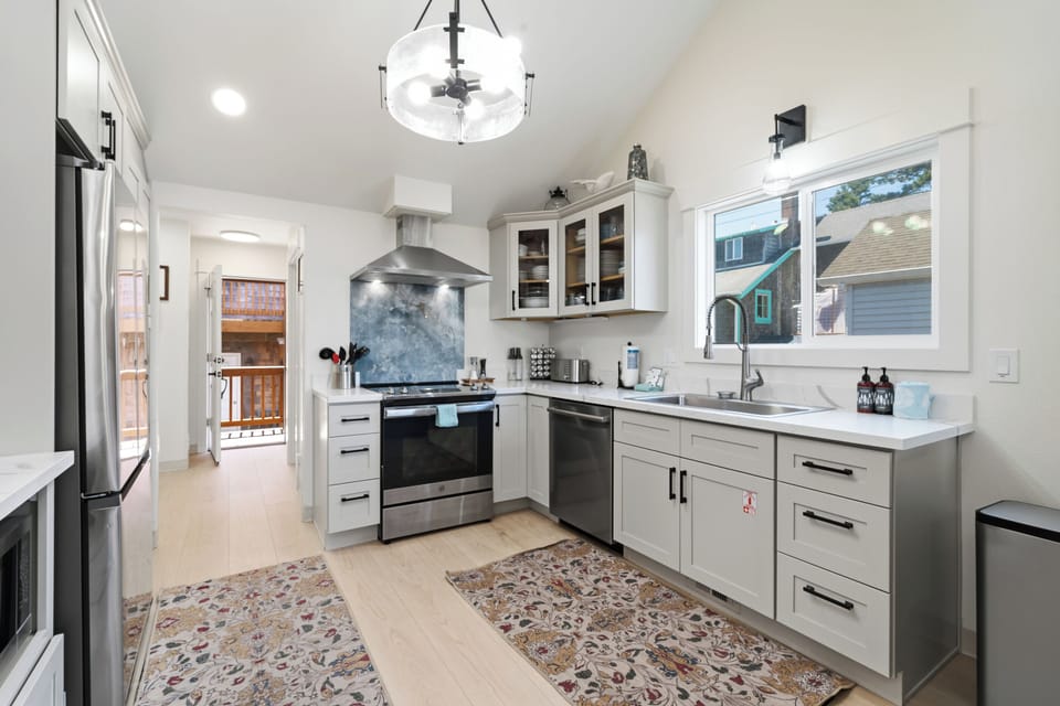 Step into your sleek, modern kitchen where bright natural light fills the space. Prepare delicious meals with high-end appliances, ample counter space, and stylish finishes—perfect for cooking and gathering.