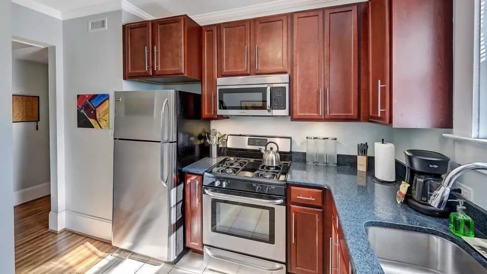 This fully equipped kitchen features modern appliances, ample counter space, and everything you need to prepare meals with ease. Bright and functional, it is perfect for both quick bites and home cooked dinners.