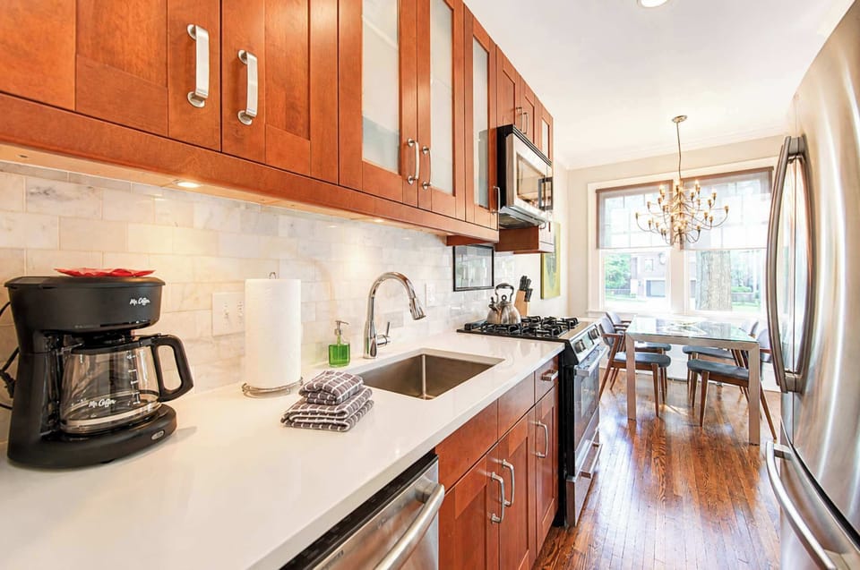 Clean and modern, this kitchen offers sleek cabinetry, stainless steel appliances, and ample counter space. A well-designed area for easy cooking and everyday convenience