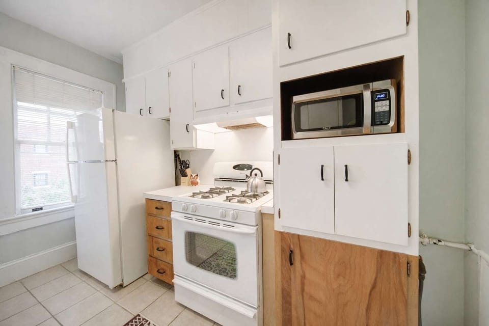 A well-appointed kitchen, offering a blend of functionality and style, provides a seamless culinary experience.
