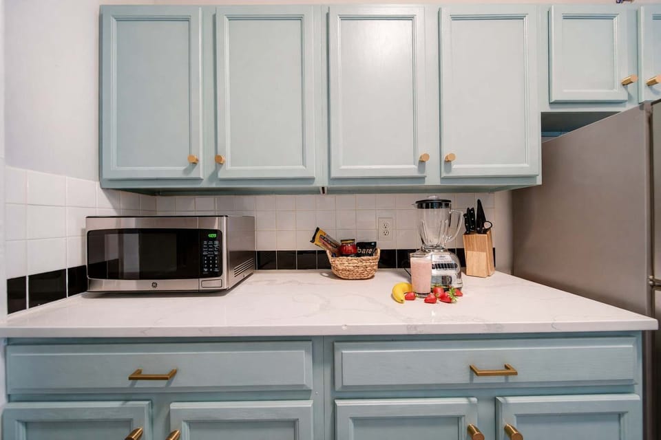 Plenty of cabinetry and a fridge offer great storage for your weekly groceries.