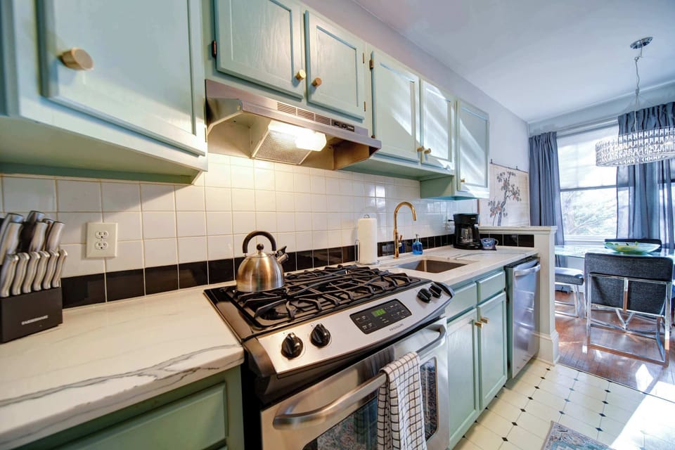 Clean lines and organized cabinets make it easy to feel right at home in this bright cooking space.