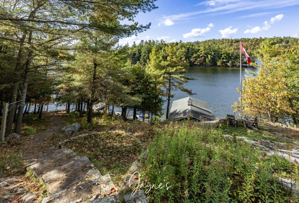 Tranquil lakeside retreat with private dock and forest views