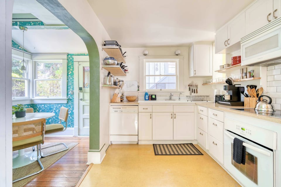Kitchen with dining nook beyond.