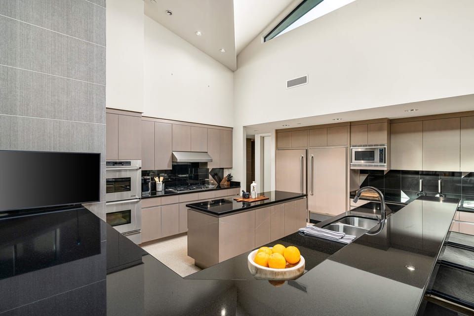 Main House Kitchen with Gas Range, Sub-Zero Refrigerator, and Double Oven