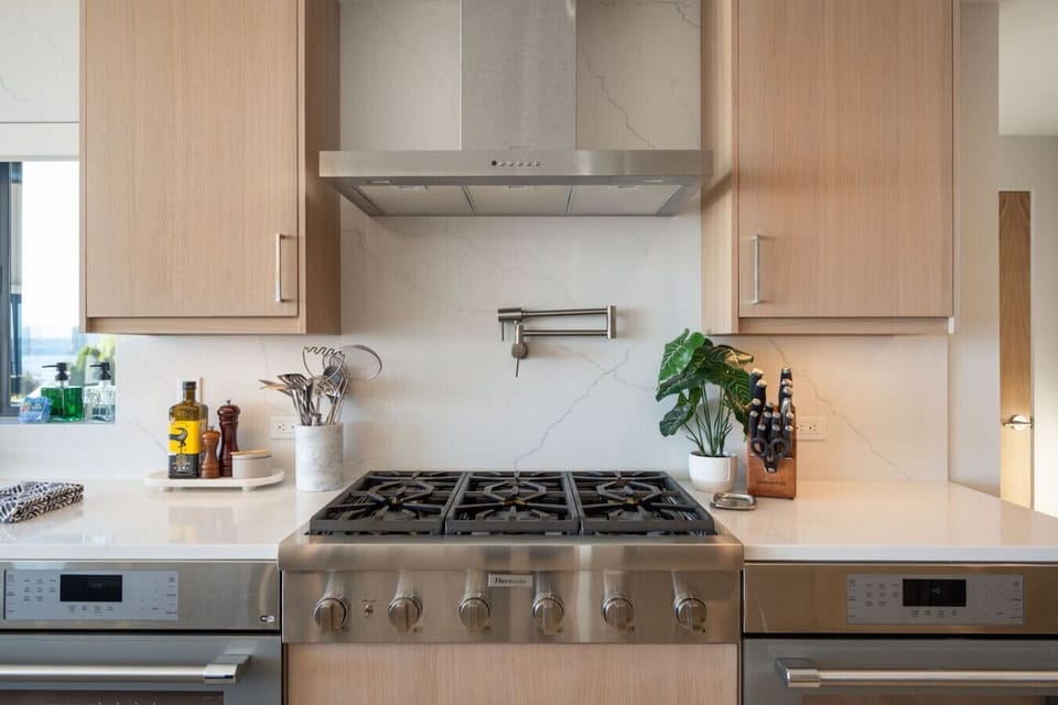 A home chef’s playground: dual ovens, six burners, and a hot water tap for effortless cooking.