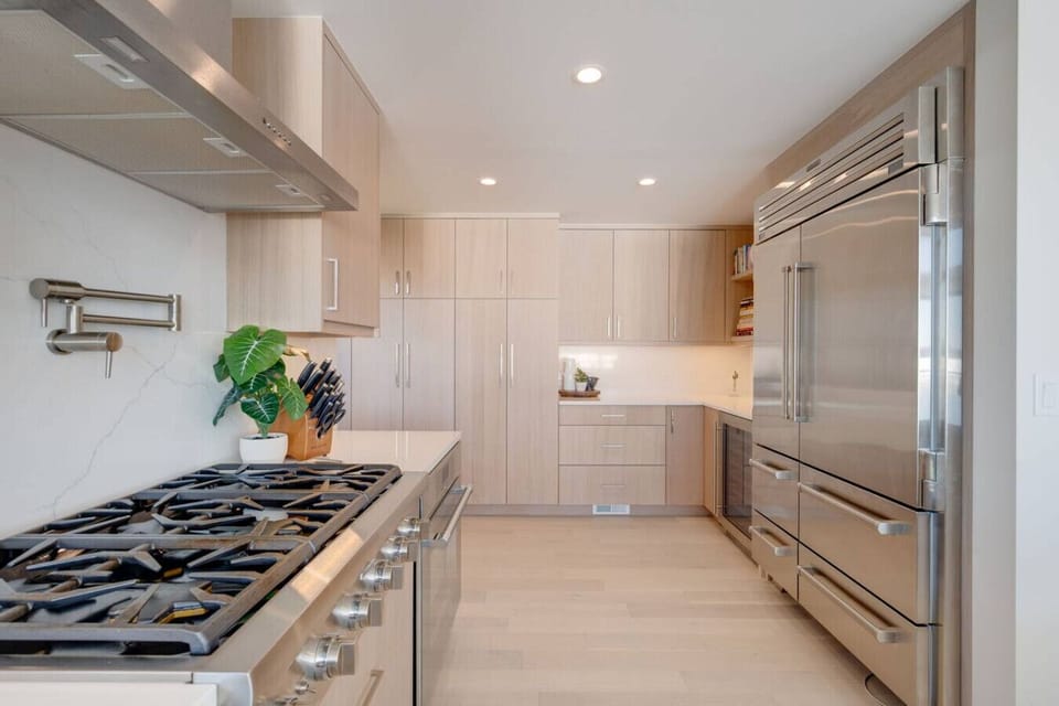 Spacious modern kitchen with sleek appliances and plenty of counter space.