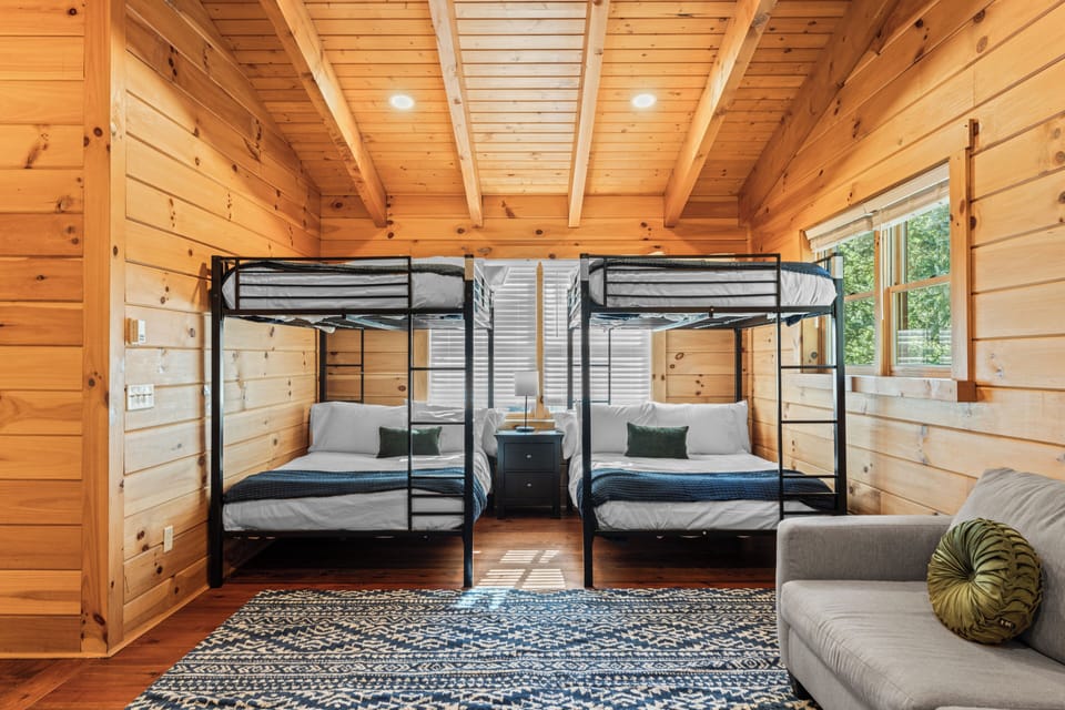 Bedroom 3 features 2x full bunk beds and a sofa