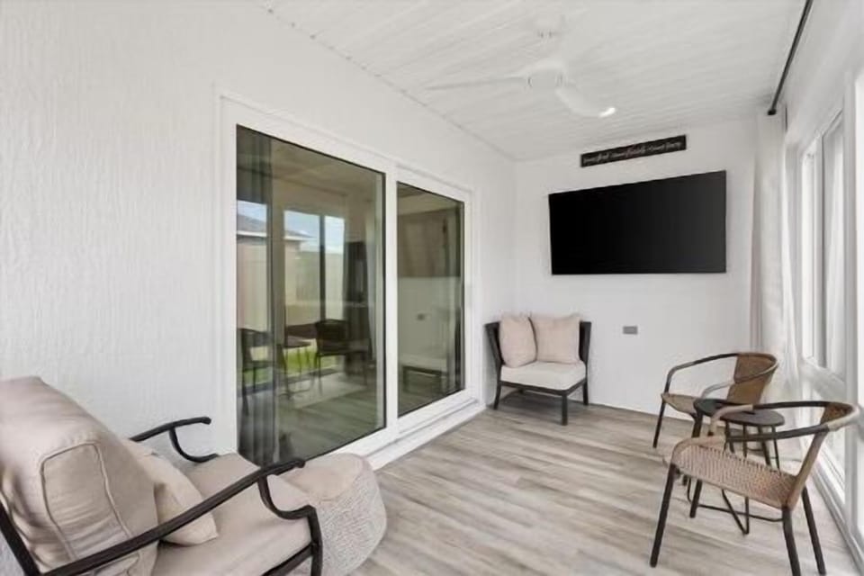 Lanai w/ Flatscreen TV. Protection for the Elements or Open the Windows for the Surrounding Screens. Doggy Door from the Lanai to the Backyard for Your Convenience!