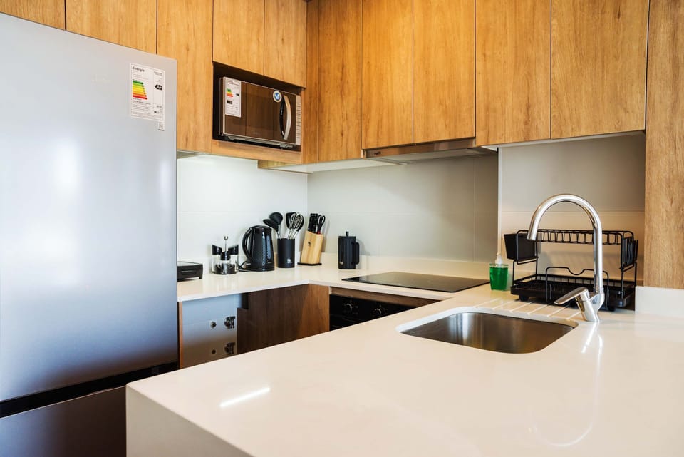Sleek and modern kitchen with all essentials for a comfortable stay.
