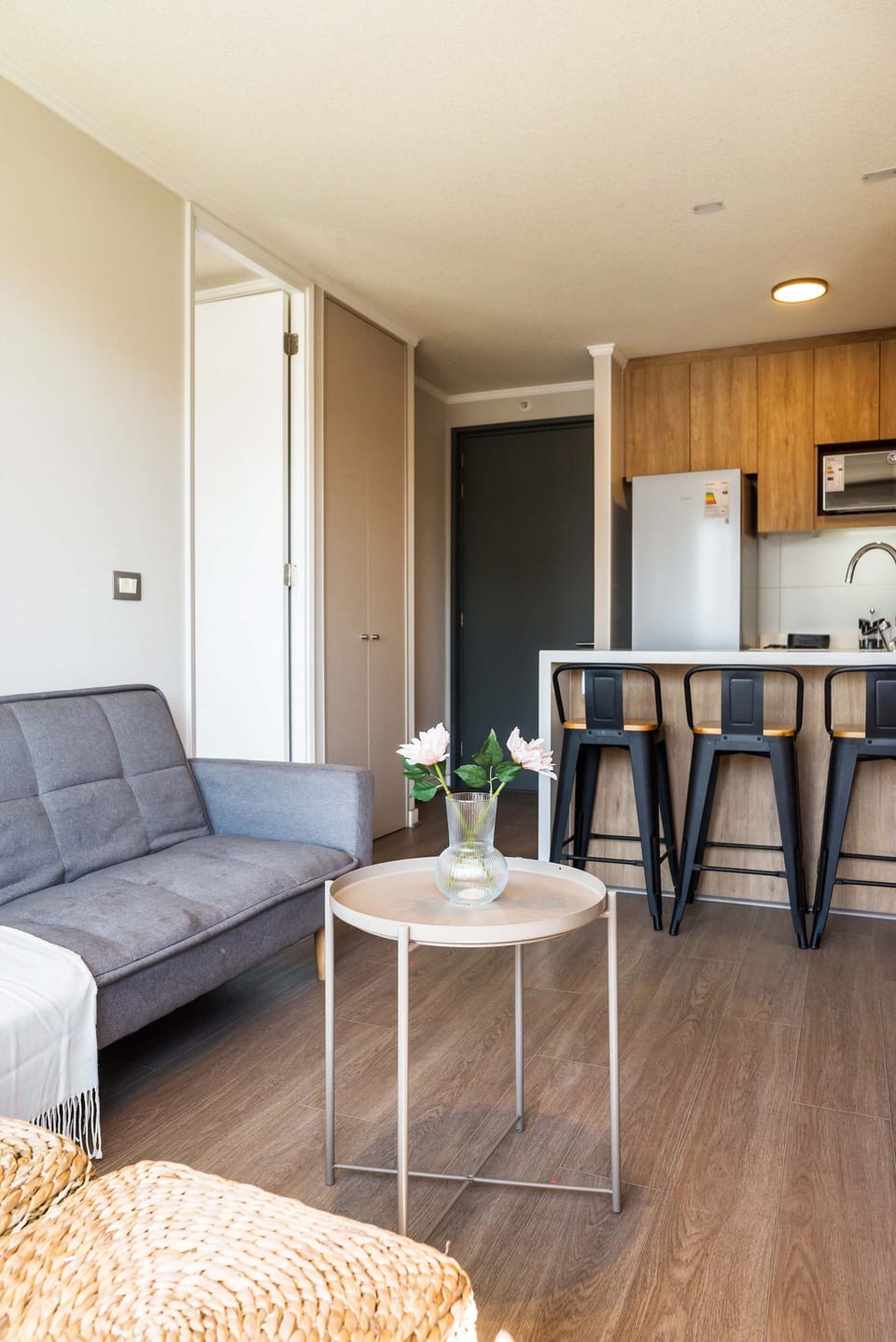 Cozy living area with modern kitchen and stylish decor, perfect for relaxing after a day of exploring.