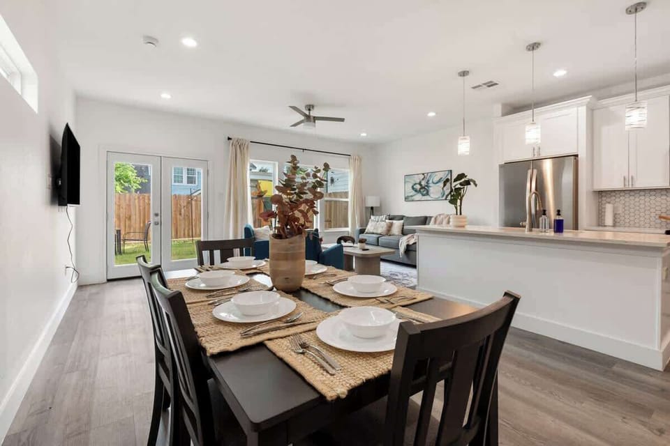 Gather around this inviting dining table for family dinners or game nights, with easy access to the kitchen and living room.