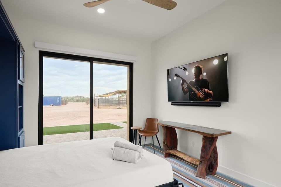 2nd bedroom with a Full murphy bed, smart TV, and en-suite bathroom.