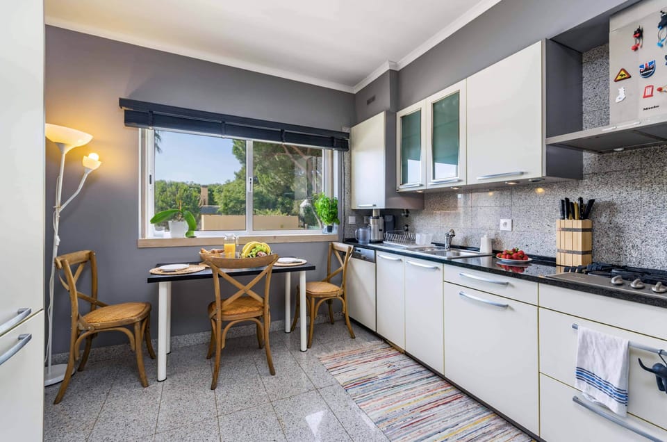 Fully equipped kitchen with smart fridge, dishwasher, oven, and more