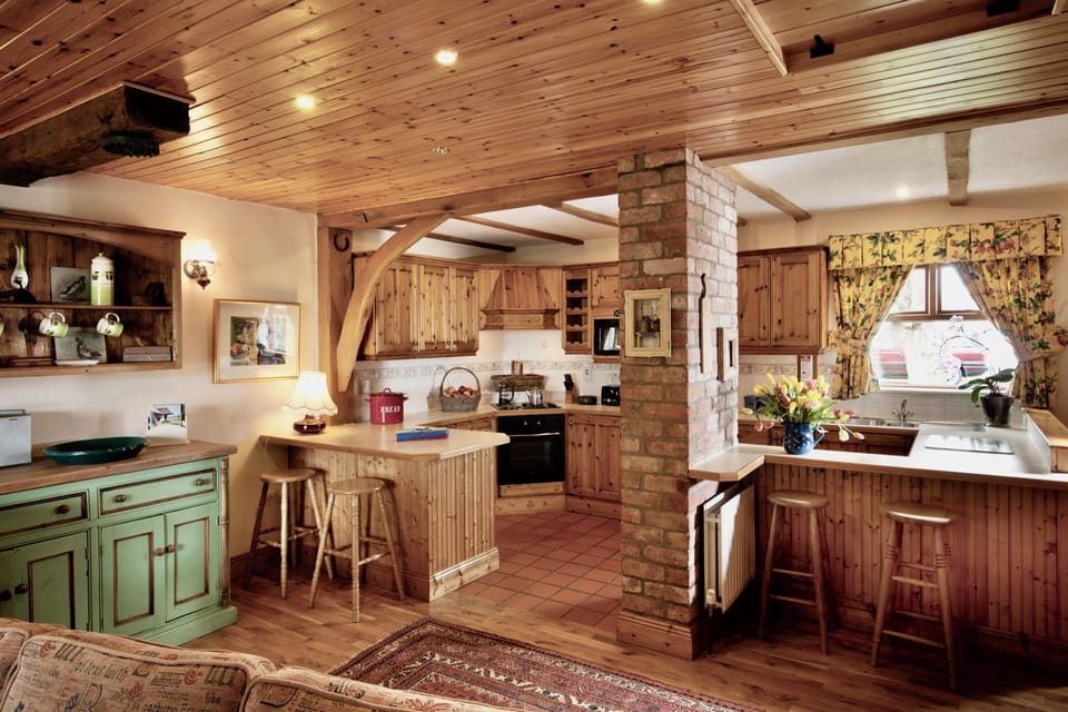 Dreamy farmhouse style, well equipped rustic kitchen.