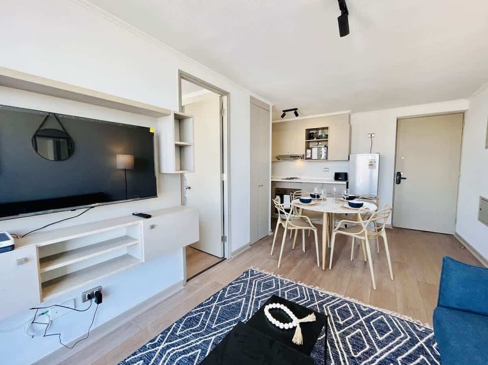 Stylish living room w/ TV, dining nook & contemporary finishes